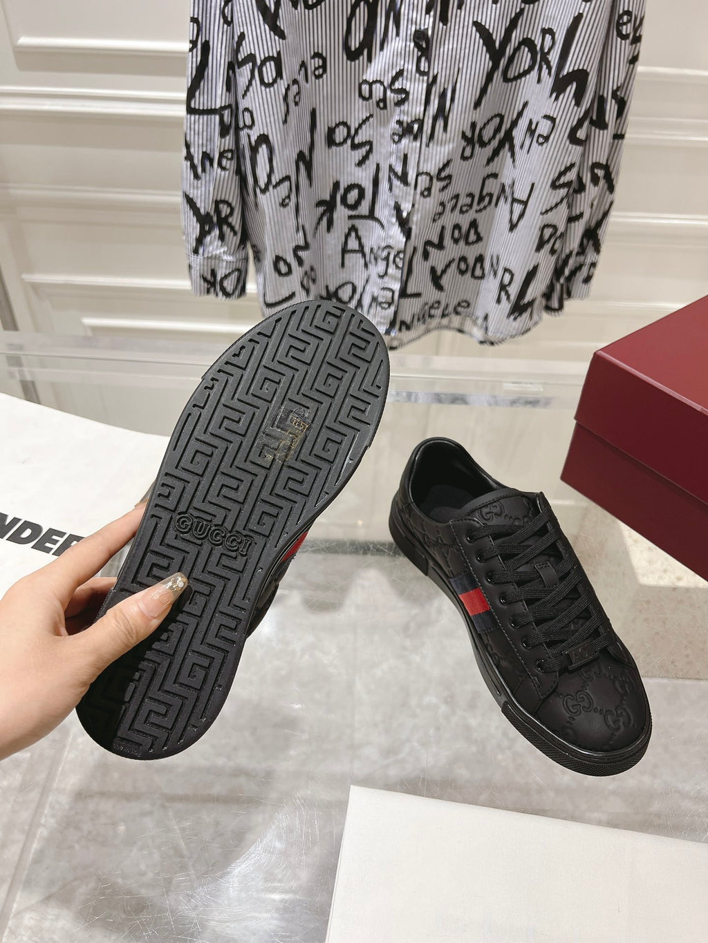 Luxury Black Sneakers with Red Signature Stripe