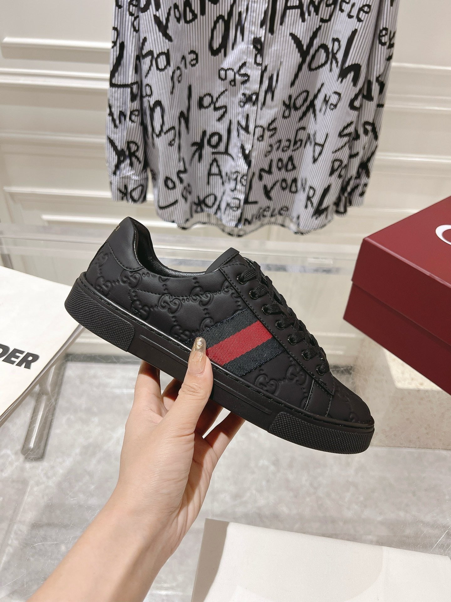 Luxury Black Monogram Sneakers with Red Signature Stripe