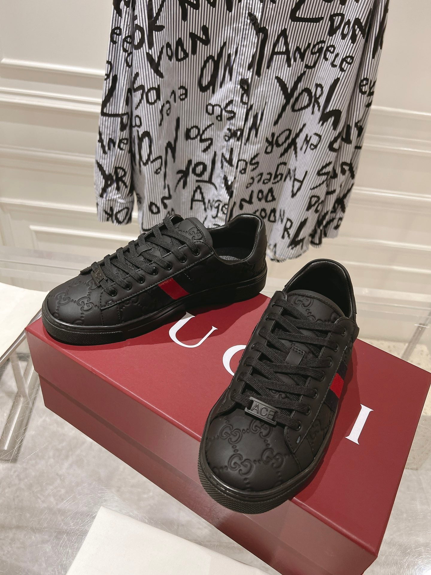 Luxury Black Monogram Sneakers with Red Signature Stripe