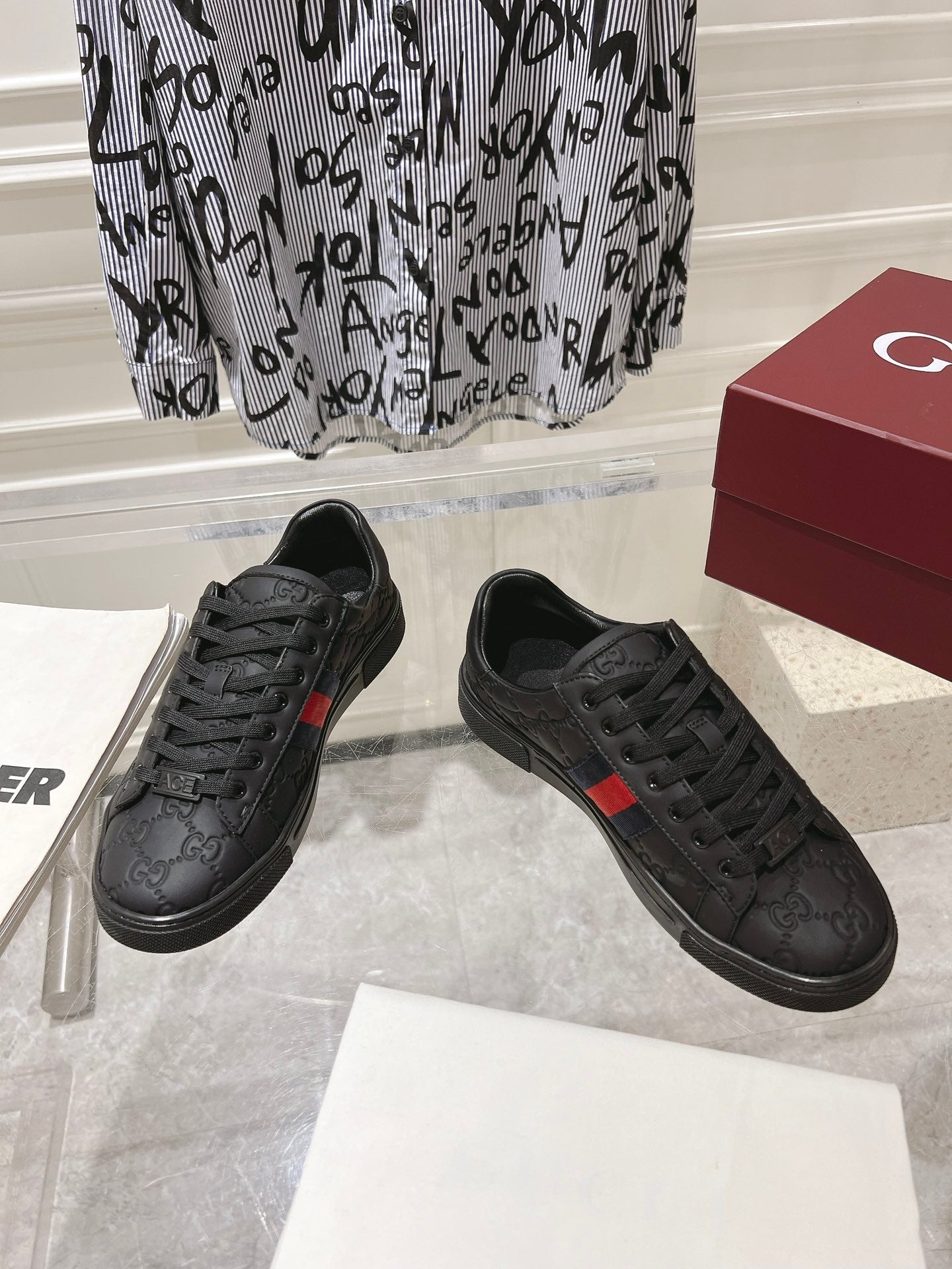 Luxury Black Sneakers with Red Signature Stripe
